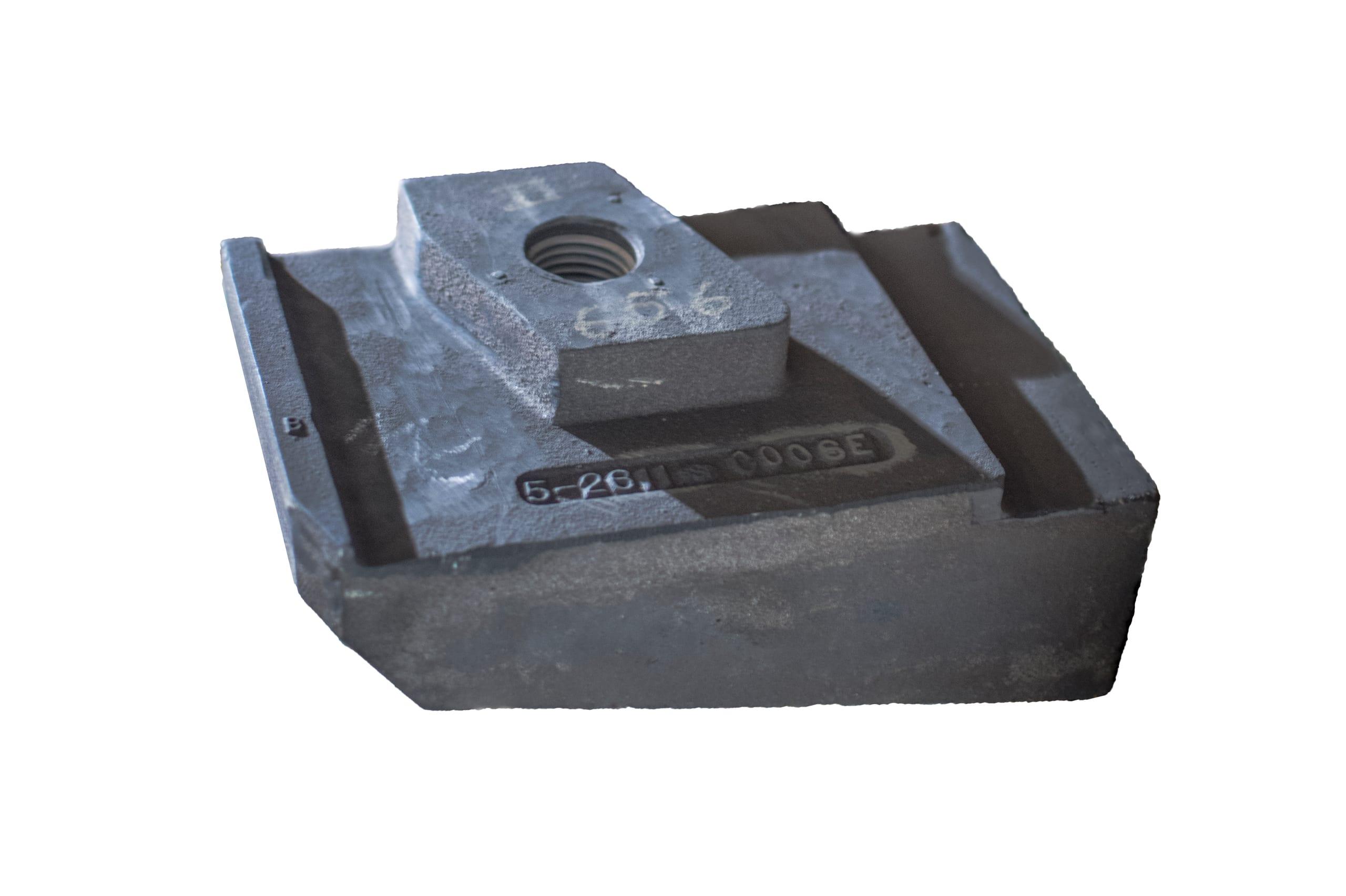 A single Si-Tec® ceramic wear shoe, its part number cast into the face beside the mounting boss.